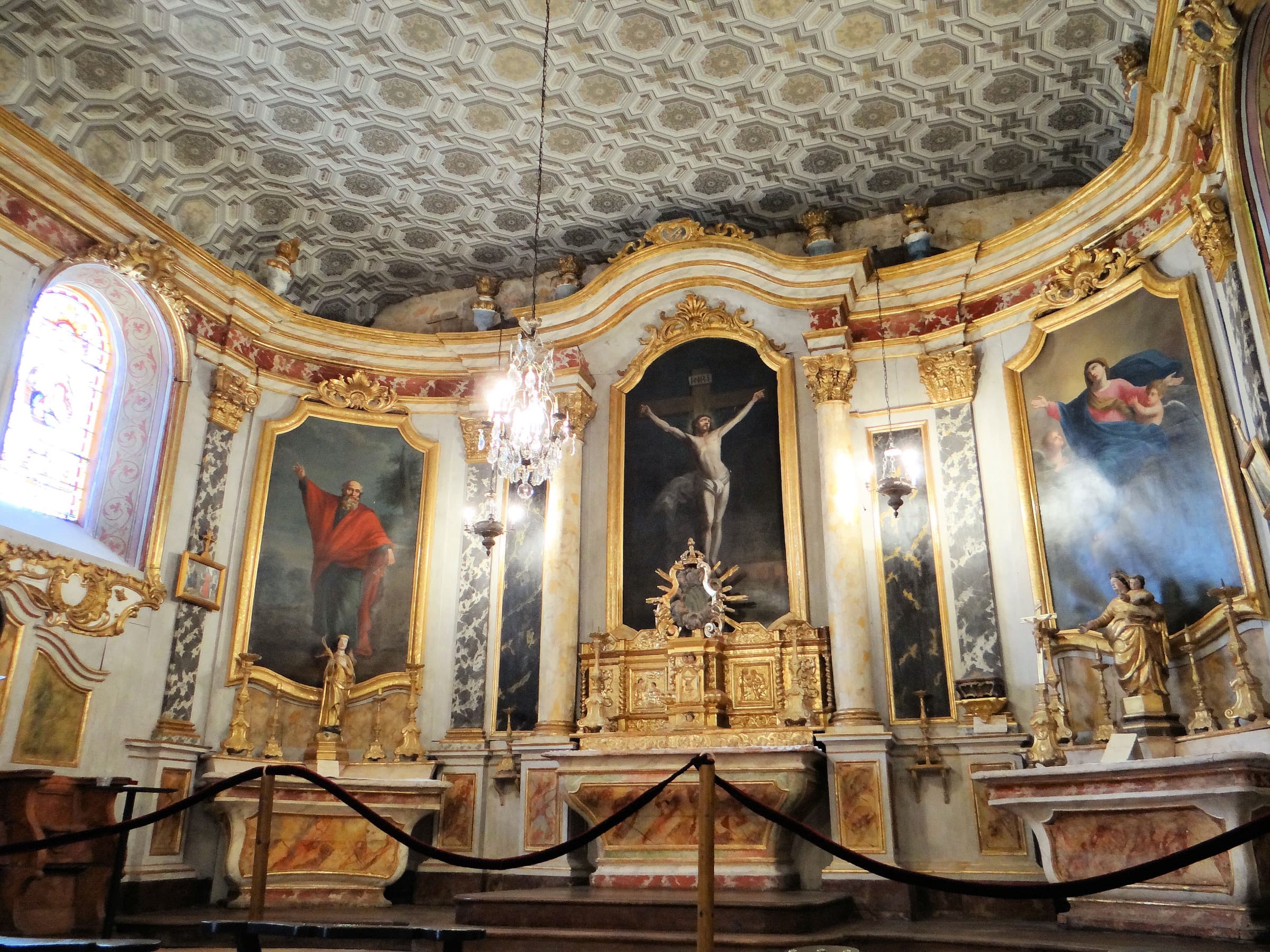 The gilded baroque interior of the church at Lachapelle, altarpiece and painted ceiling