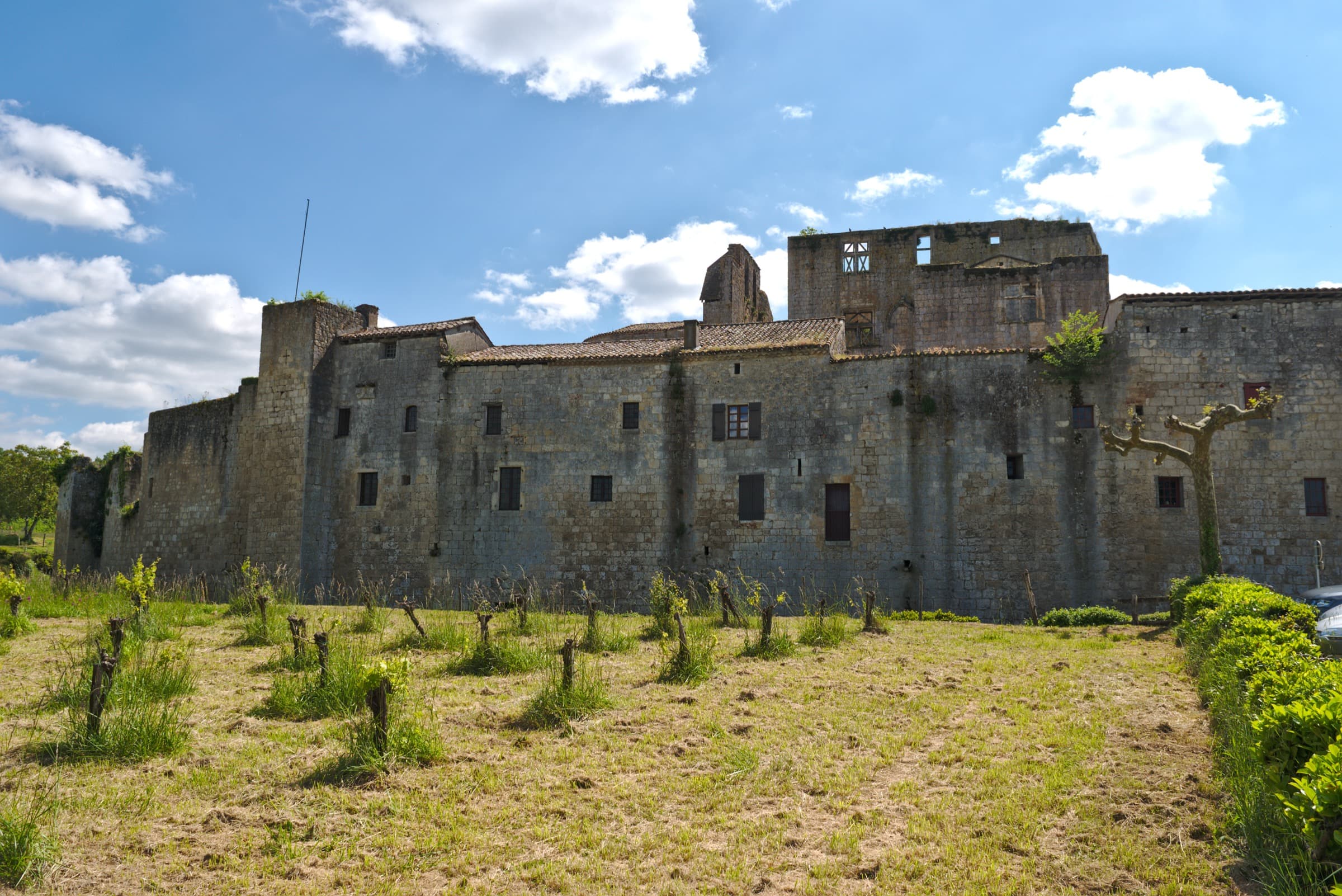 The fortified curtain wall and ruined keep of Larressingle seen from outside the enceinte