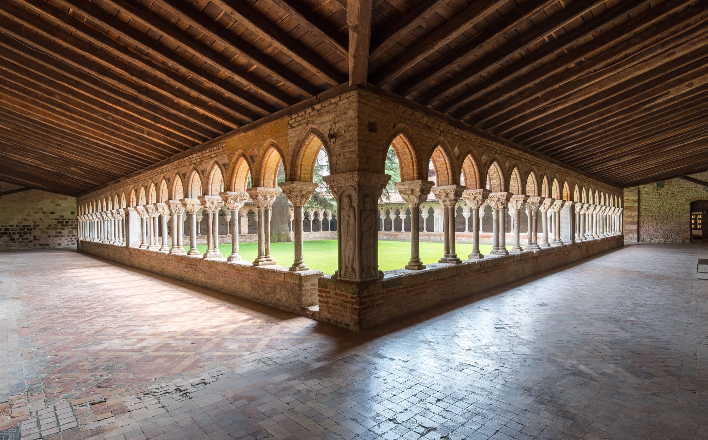 The cloister at Moissac, two galleries meeting at a corner, double colonnades with carved capitals